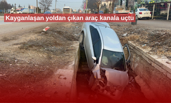 Kayganlaşan yoldan çıkan araç kanala uçtu