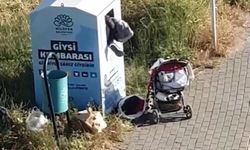 Canlarını hiçe sayarak giysi kumbarasından kıyafet çaldılar