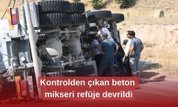 Kontrolden çıkan beton mikseri refüje devrildi