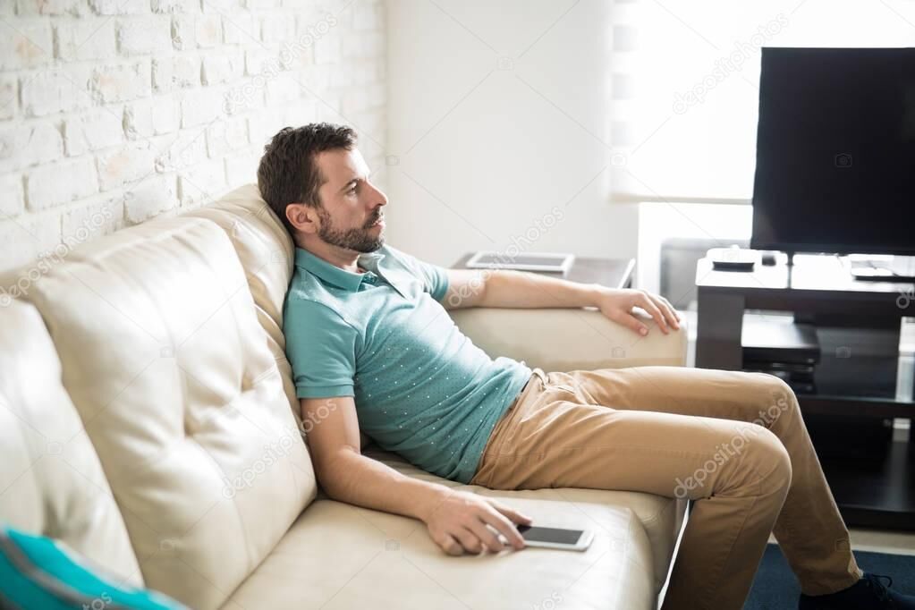 Depositphotos 165213956 Stock Photo Man Sitting In The Living